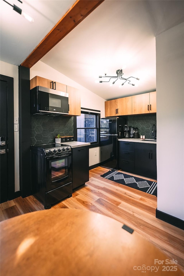 kitchen featuring light hardwood / wood-style flooring, black / electric stove, tasteful backsplash, and lofted ceiling with beams