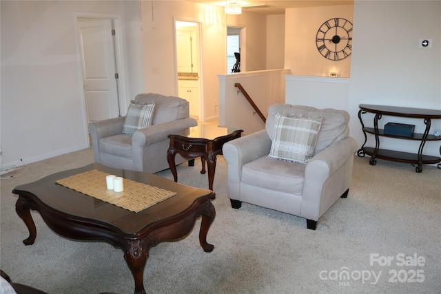 sitting room featuring light carpet