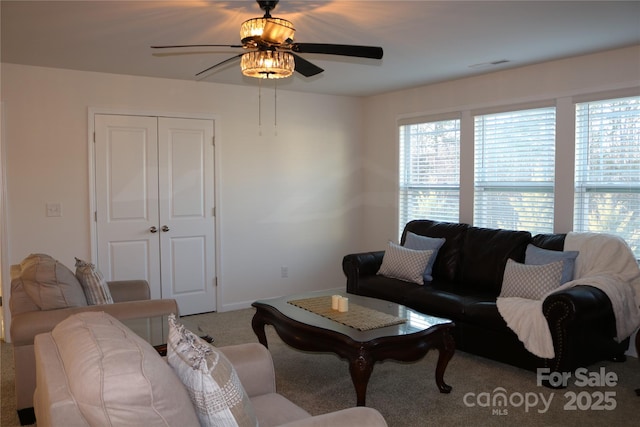 carpeted living room featuring ceiling fan