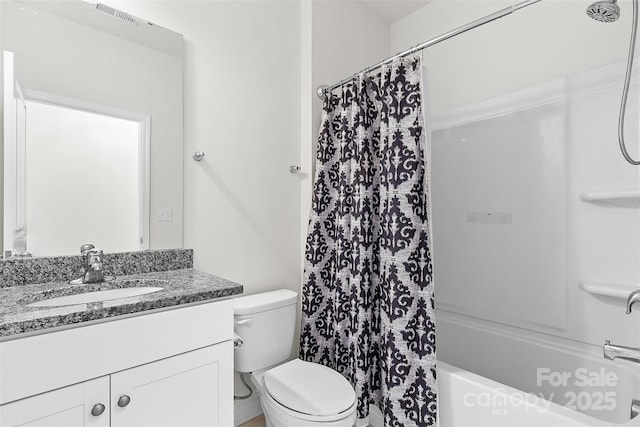 full bathroom with vanity, toilet, and shower / bath combo