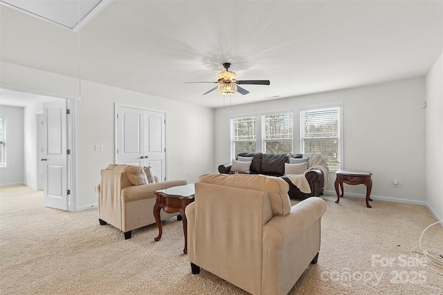 living room with ceiling fan and light colored carpet