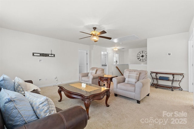 carpeted living room with ceiling fan