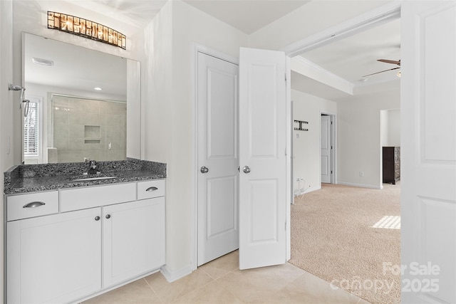 bathroom with vanity, tile patterned floors, ceiling fan, and walk in shower