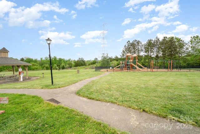 view of home's community featuring a lawn, a gazebo, and a playground