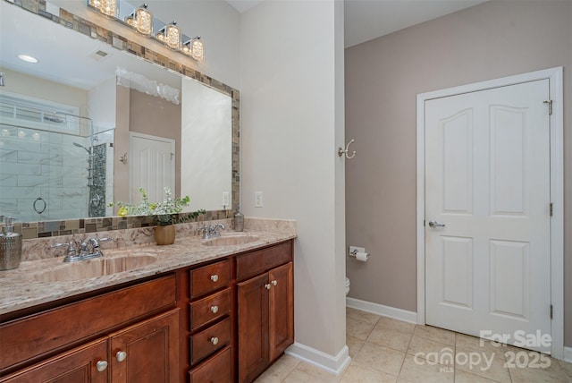 bathroom with toilet, tile patterned floors, vanity, and an enclosed shower