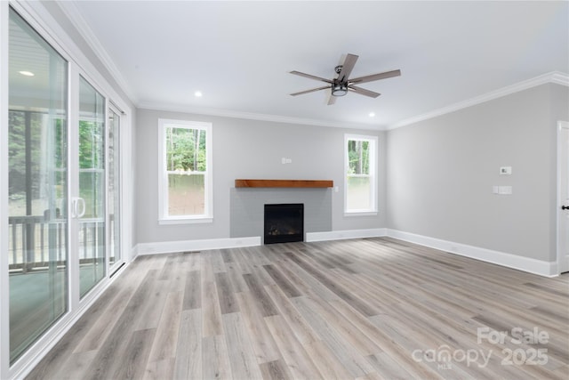 unfurnished living room featuring crown molding, light wood-type flooring, and ceiling fan