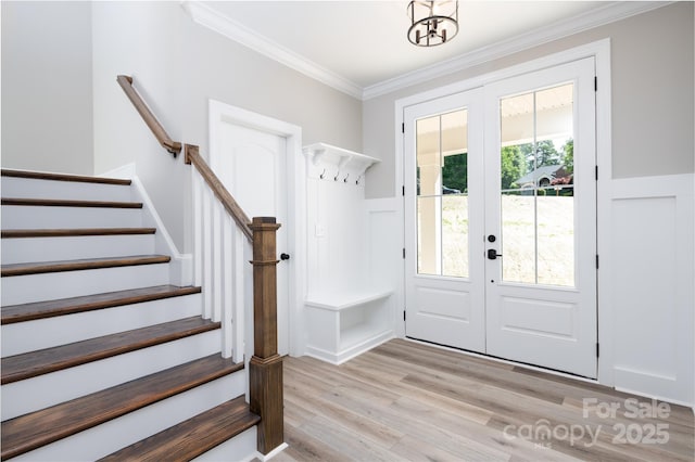 4251 Candlewood Dr, Sherrills Ford, NC 28673 - entrance foyer featuring french doors, light wood-style floors, stairway, ornamental molding, and a wainscoted wall