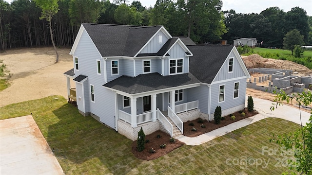 4251 Candlewood Dr, Sherrills Ford, NC 28673 - view of front of home with board and batten siding, a porch, roof with shingles, and a front lawn