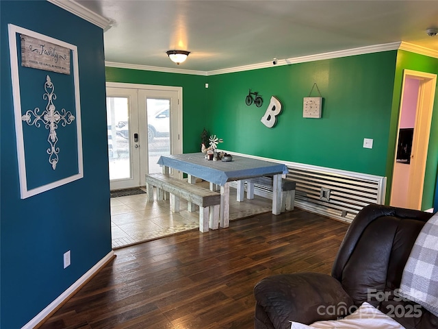 game room featuring hardwood / wood-style floors, ornamental molding, and french doors