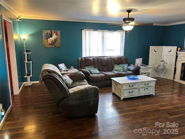 living room featuring crown molding, dark hardwood / wood-style floors, and ceiling fan