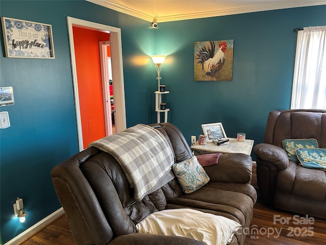 living room featuring crown molding and dark hardwood / wood-style flooring