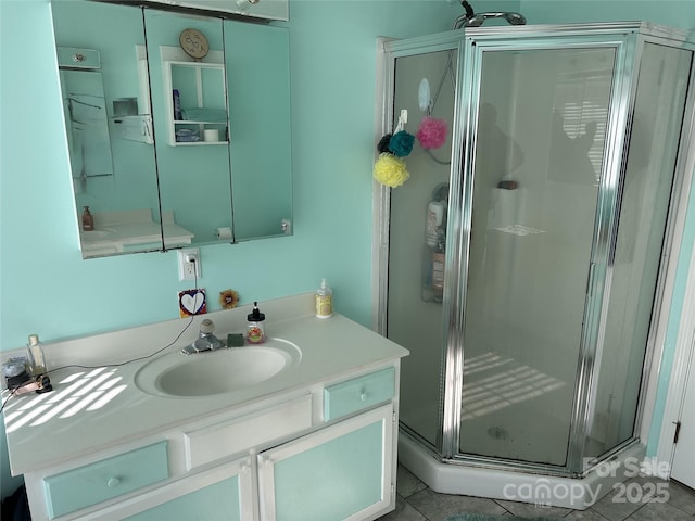 bathroom with vanity, tile patterned floors, and an enclosed shower