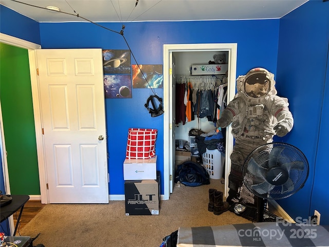 carpeted bedroom with a closet