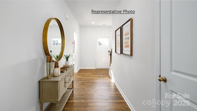 hall with light hardwood / wood-style floors