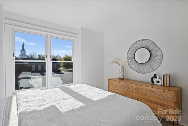 bedroom featuring vaulted ceiling