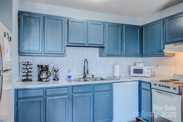 kitchen with sink, tasteful backsplash, and white appliances