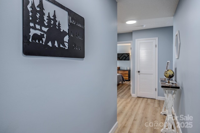 hallway featuring light hardwood / wood-style flooring