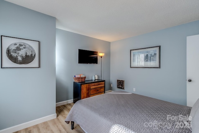 bedroom with light hardwood / wood-style flooring