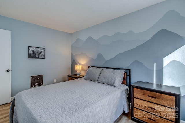 bedroom with light hardwood / wood-style flooring