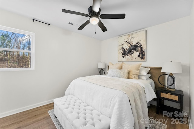 bedroom featuring ceiling fan and hardwood / wood-style floors