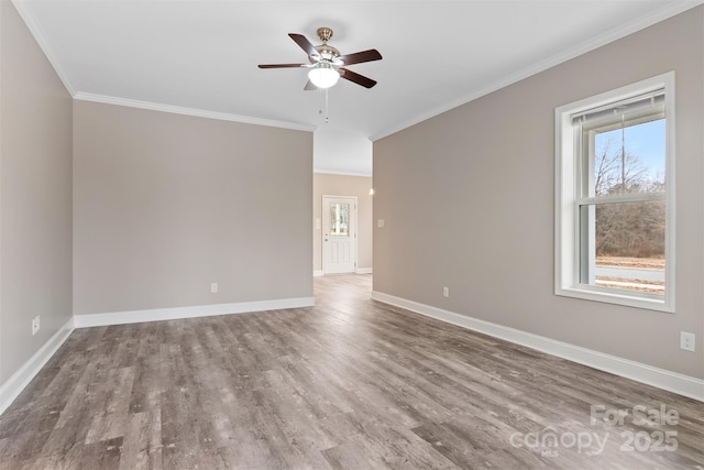 spare room featuring ceiling fan, crown molding, and wood-type flooring