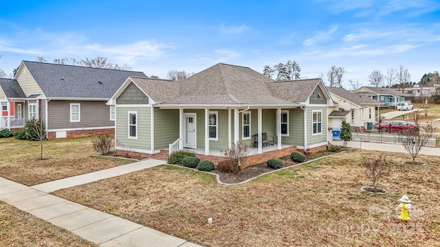 view of front of home featuring a front lawn and a porch