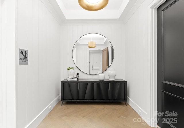 bathroom with parquet flooring, vanity, and wooden walls