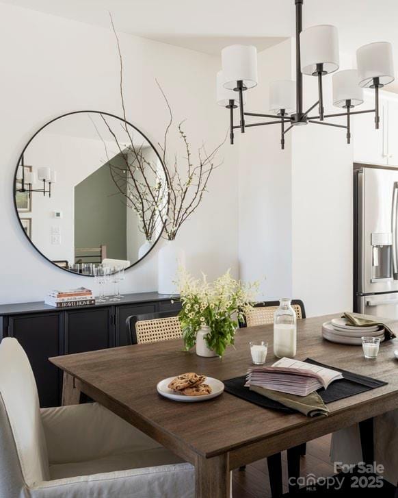 dining space with a chandelier