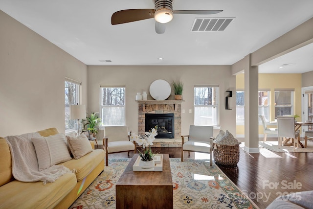 living room with ceiling fan and hardwood / wood-style flooring