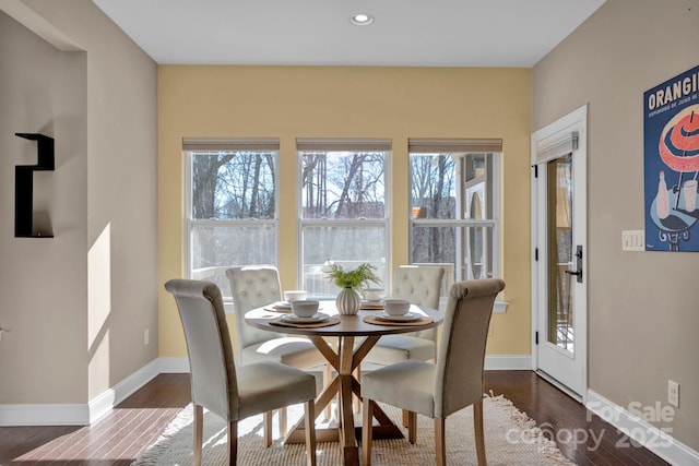 dining room with dark hardwood / wood-style flooring