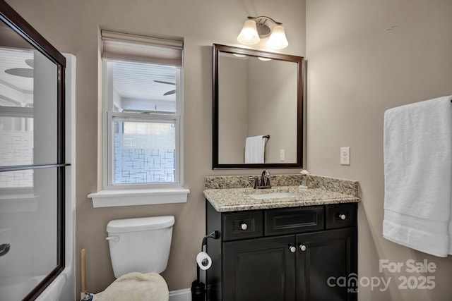 full bathroom with toilet, vanity, and combined bath / shower with glass door