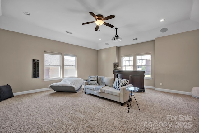 living room featuring ceiling fan and light carpet