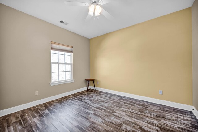 unfurnished room with ceiling fan and wood-type flooring