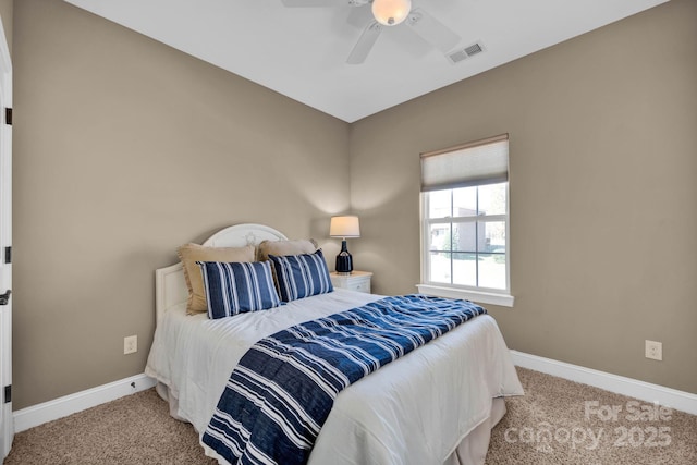 bedroom with ceiling fan and light colored carpet