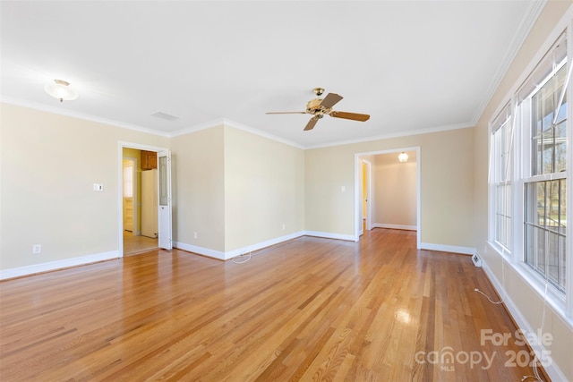 spare room with ceiling fan, ornamental molding, and light hardwood / wood-style flooring