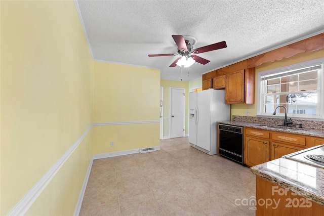 kitchen featuring ceiling fan, dishwasher, sink, a textured ceiling, and white fridge with ice dispenser