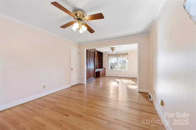 spare room with ceiling fan, light hardwood / wood-style flooring, and ornamental molding