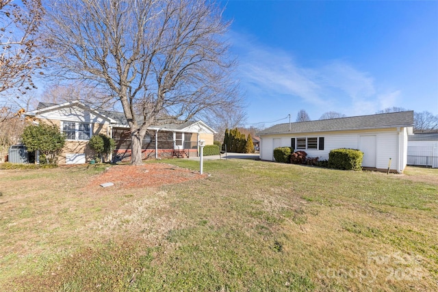 view of front of property featuring a sunroom and a front yard