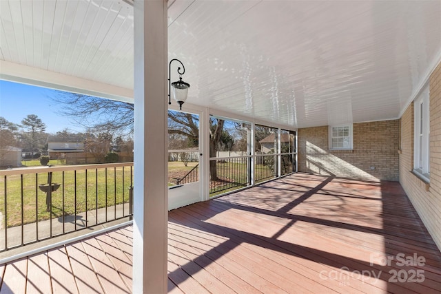 unfurnished sunroom with plenty of natural light