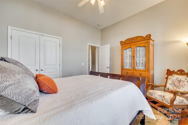 bedroom with ceiling fan and a closet