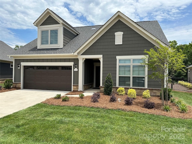 craftsman-style home with a garage and a front yard