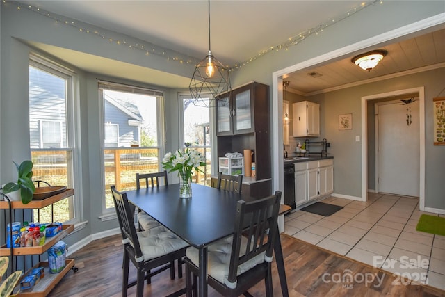 tiled dining area with crown molding