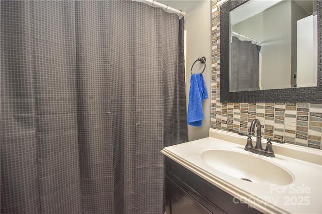 bathroom with vanity and backsplash