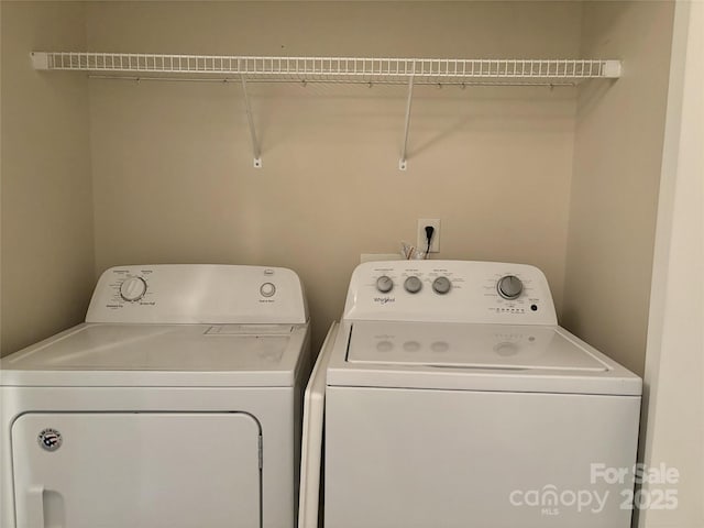 laundry room with independent washer and dryer