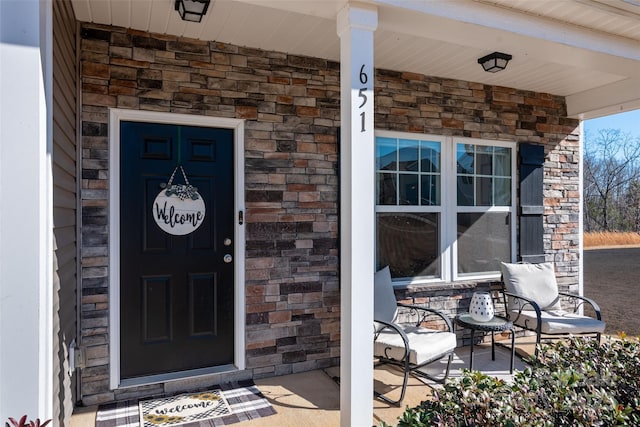 doorway to property featuring a porch