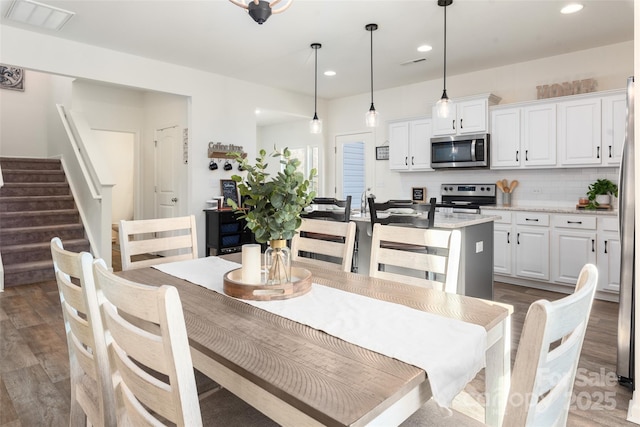 dining room featuring dark wood-type flooring