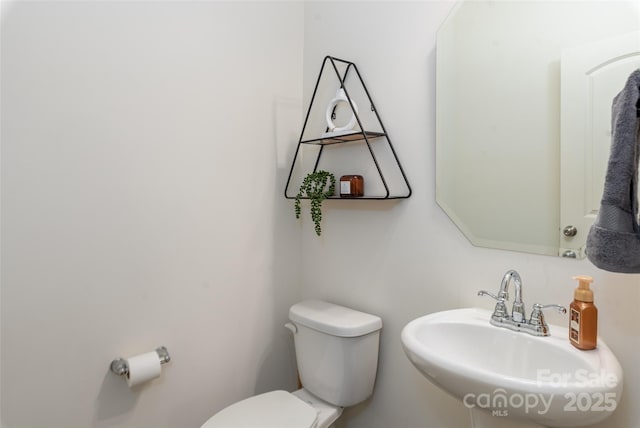 bathroom with toilet and sink