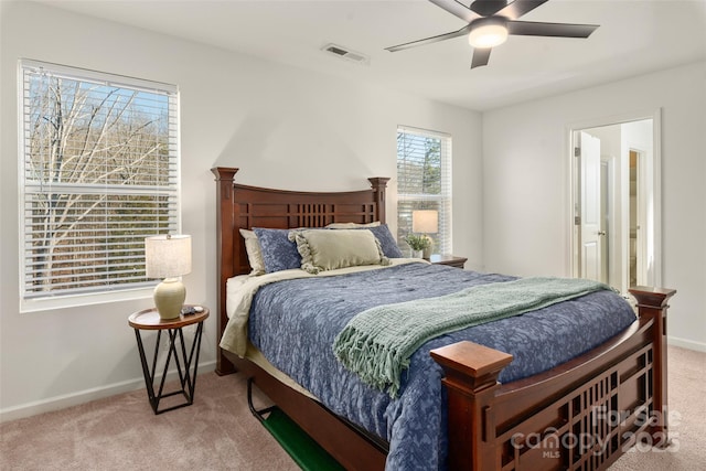 bedroom featuring ceiling fan and light carpet