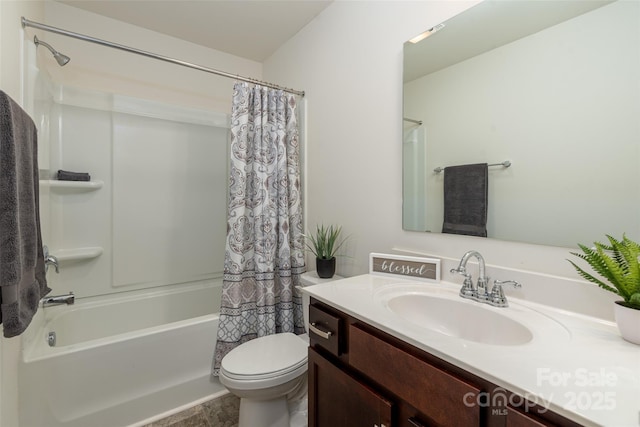 full bathroom with vanity, shower / bath combo with shower curtain, and toilet