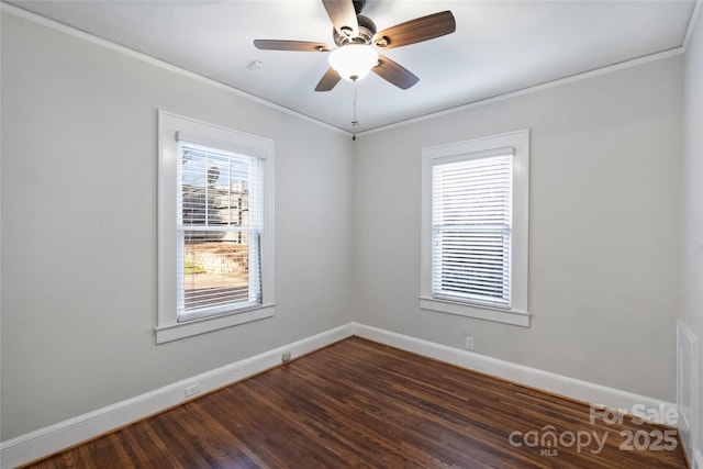 empty room with ornamental molding, dark hardwood / wood-style floors, and ceiling fan